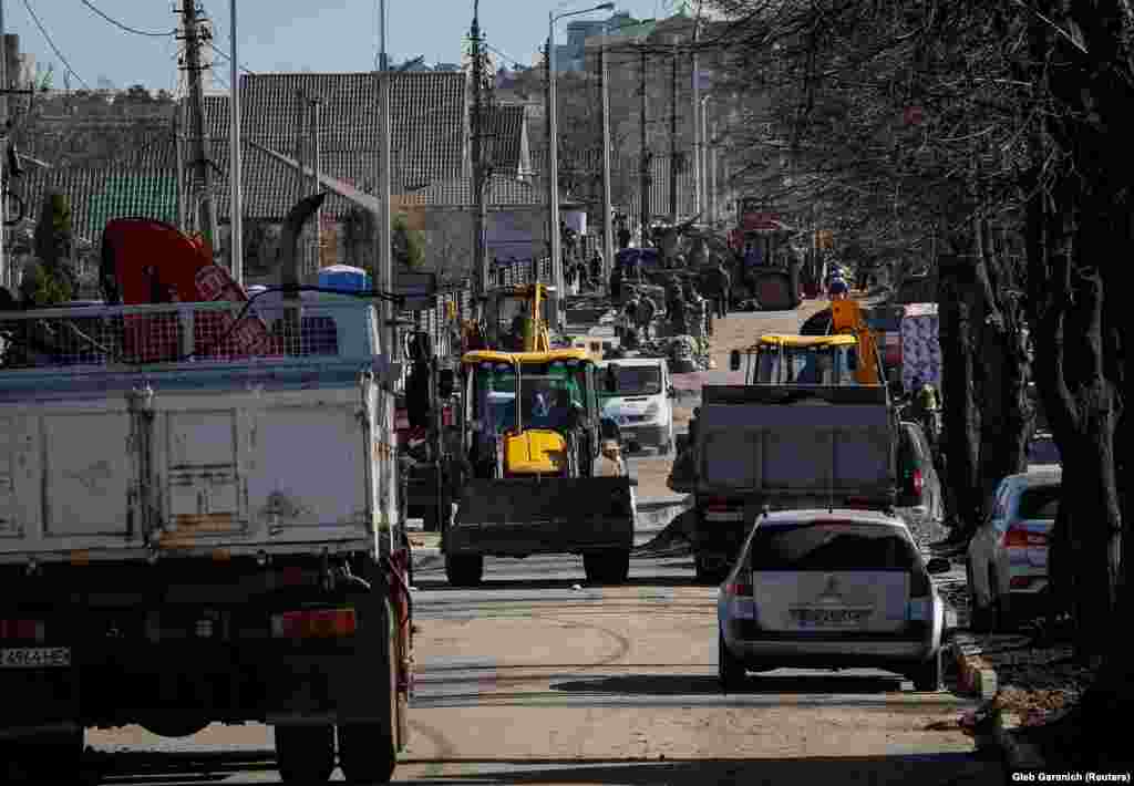 Nearly a year later, community workers have rebuilt the streets, erasing most of the visible signs of death and destruction.