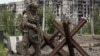 У Маріуполі спостерігається безвладдя і розгул криміналу, повідомляють журналісти місцевих видань. На фото: військовий ПВК «Вагнер» у Донецькій області (фото ілюстраційне)