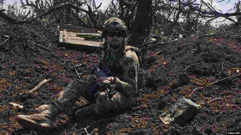 A soldier keeps watch from a trench that was formerly held by Moscow's forces. The commander of Ukraine's ground forces, General Oleksandr Syrskiy, said that Russian units were attempting counterattacks to recover the ground they had recently lost to advancing Ukrainian forces. “The Bakhmut front has become an arena of active hostilities again.... The enemy is desperately clinging to positions and strongholds that were formerly occupied by Wagner Group fighters.… Events unfold and change very rapidly, with some positions changing hands twice a day,” Syrskiy said, in comments reported by the Ukrainska Pravda magazine.