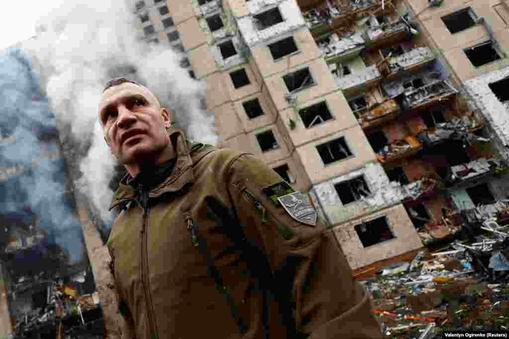 Kyiv Mayor Vitali Klitschko surveys the devastation at a heavily damaged residential building. The barrage extended Russia's escalated attacks on Ukraine that began on December 29 with its largest single assault on Ukraine since the war started that left at least 41 civilians dead.