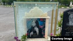 A photo showing damage to the gravestone of Mahsa Amini, who died in police custody in September. 