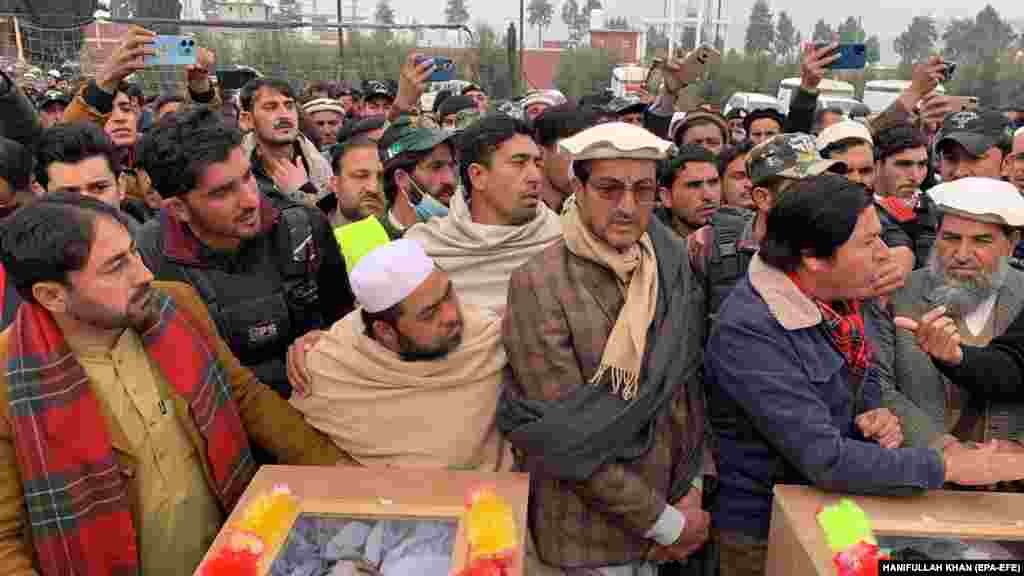 Relatives and police officials attend the funeral of police officers killed in the blast. The January 8 attack occurred after the government began another round of its regular vaccination drives.