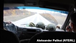 Serhiy Skoryk and Eduard Lakyonov speed along roads in the Kherson region.