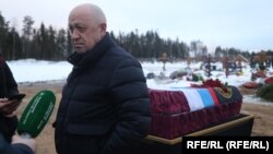 Wagner founder Yevgeny Prigozhin attends the funeral of one of his fighters in December.