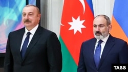RUSSIA - Azerbaijan's President Ilham Aliyev and Armenia's Prime Minister Nikol Pashinian attend a group photo ceremony during an informal CIS summit in St. Petersburg, December 26, 2022. 