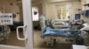 Armenia -- A COVID-19 patient and a medic at the intensive care unit of Surp Grigor Lusavorich hospital, Yerevan, May 10, 2020. (A photo by the Armenian Mnistry of Health)