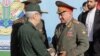 Russian Defense Minister Sergei Shoigu meets with the chief of staff of Iran's armed forces, Mohammad Bagheri, in Tehran on September 19. 