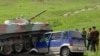 При выводе боевой техники узбекская боевая машина десанта совершила наезд на автомобиль гражданина Кыргызстана. Ранены двое граждан Кыргызстана. Баткен, 2 июня 2010 года. 