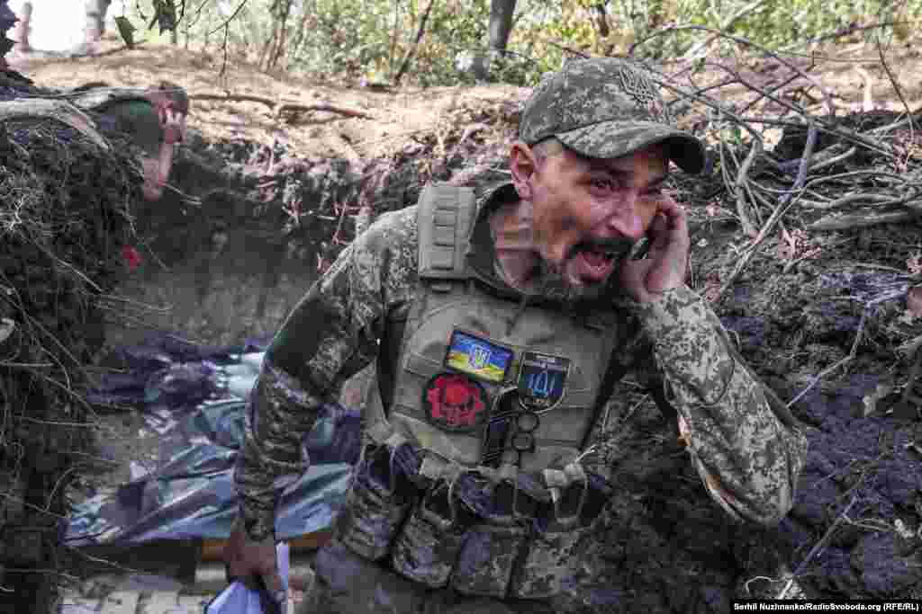 Artem, a 40-year-old Ukrainian commander, shouts a warning before his artillery team fires toward Russian positions near Pokrovsk in early October. 