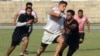 Mustafa Sadat (center) plays in a rugby tournament in Lahore, Pakistan in October 2011.
