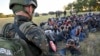 A group of migrants detained in Subotica, northern Serbia, on July 13, 2022