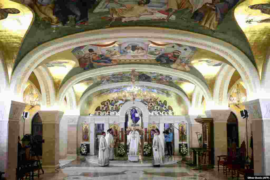 Serbian priests hold a morning Easter liturgy in the crypt of the cavernous St. Sava Temple, one of the world&rsquo;s largest Orthodox houses of worship, in Belgrade on April 19. Most parishioners stayed away in an effort to limit the spread of the coronavirus. In Serbia, Montenegro, and Northern Macedonia, Easter holidays were celebrated at home, without the possibility of believers attending church services.