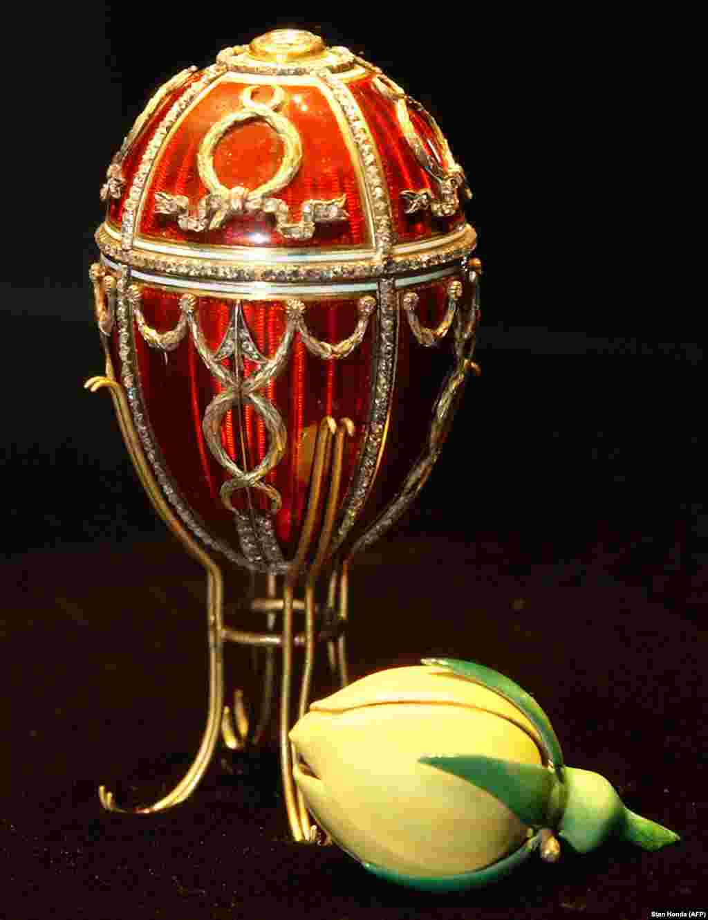 The Rosebud Egg, the first that Nicholas II gifted to his wife, Aleksandra. A cupid's arrow made from diamonds enlivens the red lacquer, while inside, an enamel rosebud symbolizes the love blooming between the newlyweds. A year after this egg was presented, a stampede at a celebration following Nicholas's coronation killed hundreds in the crowd. Following the advice of relatives, Nicholas proceeded with the coronation celebrations as ordinary Russians mourned their dead. It was his first fateful mistake as tsar.