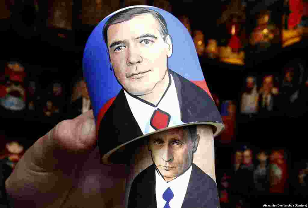 A matryoshka or Russian nesting doll at a market in St. Petersburg shows Putin lurking behind Medvedev.&nbsp;
