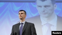 Mikhail Prokhorov addresses supporters at a meeting in Moscow on December 15.