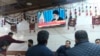 Customers at an Iraqi tea house watch the news on TV after Iran launched a number of missiles at bases in Iraq hosting U.S.-led coalition troops, in Irbil on January 8. 