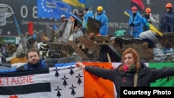 Dimitri Halby and his wife, Oksana, are helping to coordinate global protests against the sale of Mistral warships to Russia. They are shown here participating in Euromaidan protests in Kyiv in February.