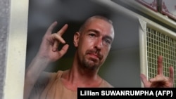 Aleksandr Kirillov arrives at a holding cell to face trial at a court in Pattaya on April 17.
