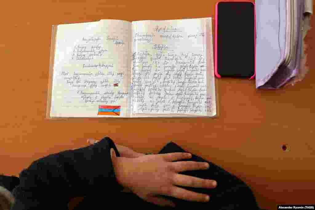 A child's texbook at a school in Stepanakert features a drawing of the separatist Nagorno-Karabakh flag on December 2. 