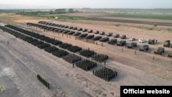 Tajik Army units gather outside Dushanbe on July 22.