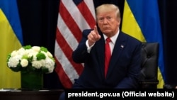 U.S. President Donald Trump gestures during his meeting with Ukraine's Volodymyr Zelenskiy in New York on September 25.