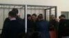 Подсудимых по делу «Таблиги Джамаат» заводят в зал суда. Астана, 22 января 2016 года.