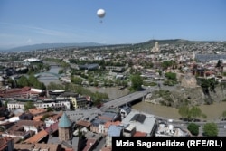 A picturesque view of Tbilisi from the Narikala fortress with the meandering Kura River.