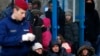 Hungarian police guard Kosovar migrants after they illegally crossed the Hungarian-Serbian border in early February.