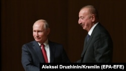 Владимир Путин (слева) и Ильхам Алиев, 27 сентября 2018 г.