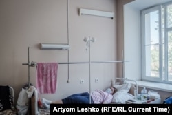 Tatyana rests in her hospital bed.