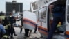 Россия - Спасатели и сотрудники скорой помощи работают на месте аварии в метро, Москва, 15 июля 2014 г․