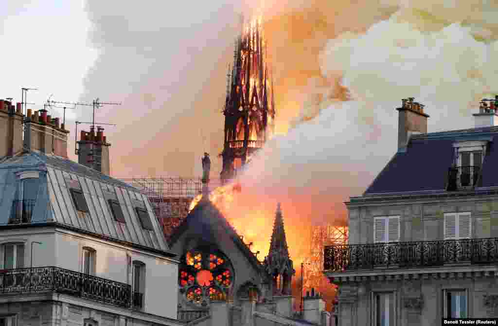 Smoke billows as fire engulfs the cathedral on April 15, 2019.